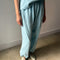 model wearing sky blue cotton balloon pants and matching t-shirt