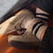 model wearing heather oatmeal crew socks with double navy stripes at the top