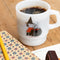 white milk glass mug with snoopy dressed as a witch stirring a brew