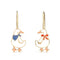 front view of gold goose dangle earrings