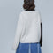 solid white back of abstract face sweater