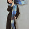 side view of model wearing thick scarf with various shades of blue checkers and fringe
