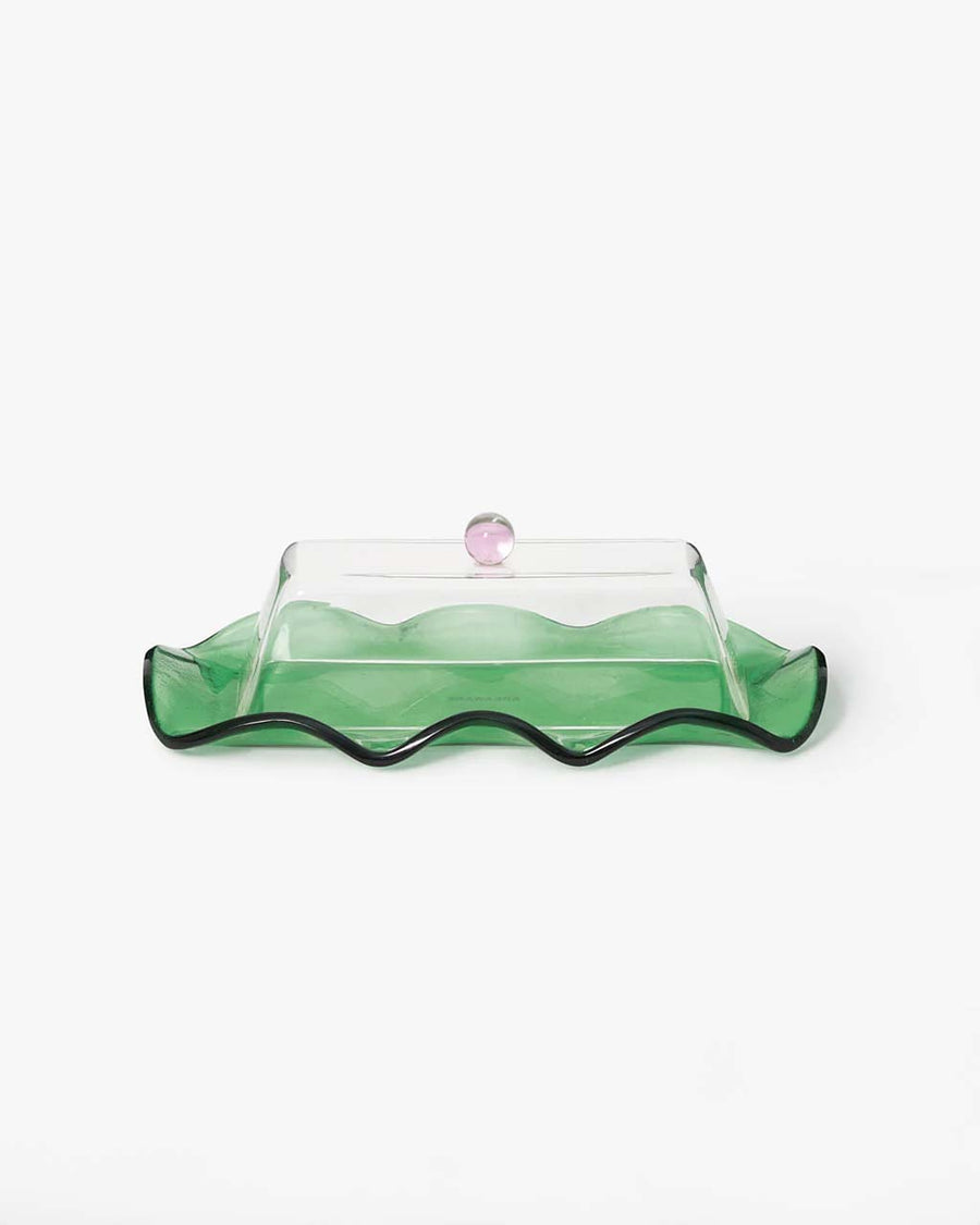 glass butter dish with clear lid and pink knob and green base