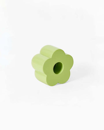 green flower shaped incense and candle holder