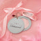 light blue leatherette mirror keychain with cursive 'delusional' across the front and with heart and ballet slipper charm
