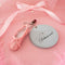 light blue leatherette mirror keychain with cursive 'delusional' across the front and with heart and ballet slipper charm