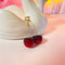 gold cherry dangle earrings