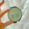 model holding mint retro swan design pill case