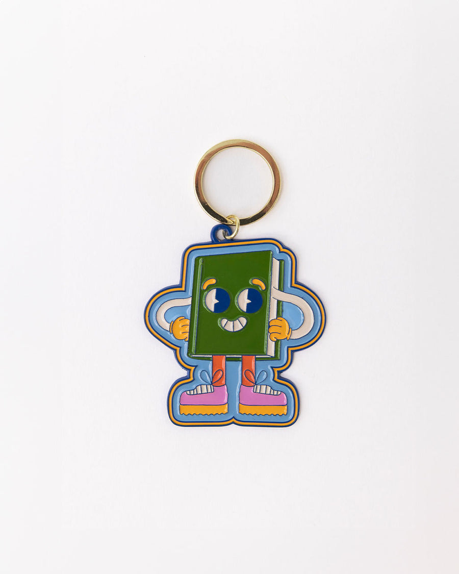 enamel keychain with green book man with arms, face and legs