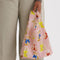 model carrying pink baby baggu with all over teddy bear print