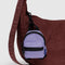 wisteria backpack charm with black trim on a brown purse