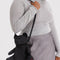 model wearing nylon plush black teddy bear crossbody purse