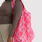 model wearing pink plaid starry big baggu
