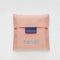 pale pink standard baggu with baby blue 'i brake for bookstores!' across the front in a reusable pouch