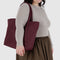 model carrying mahogany cloud bag with front pocket