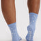 back view of light blue crew socks with white star print
