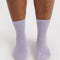 model wearing metallic lilac crew socks