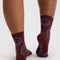 back view of mahogany crew socks with lilac smiley faces
