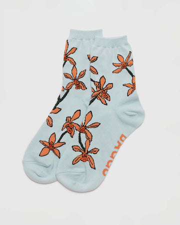 light blue crew socks with orange orchid print