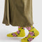 model wearing mustard yellow crew socks with pink rose print