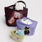 set of 3 go pouch: small yellow fancy dog, lilac fancy cat, and large mahogany fancy teddy bear with items inside