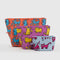 set of three keith haring print pouches: large orange dog, medium purple dogs, and small light blue cat print