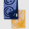folded set of two smiley hand towels: light blue and navy smiley and cream and yellow smiley