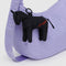 black horse bag charm with red baggu on the back on a lavender bag
