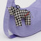 black and white gingham horse bag charm with red baggu on the back on a lavender bag