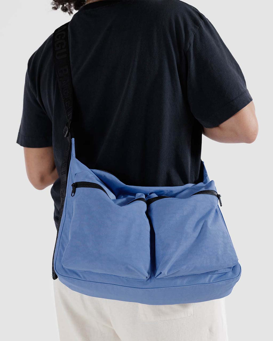 model wearing pansy blue large cargo crossbody bag