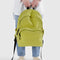 model holding lemongrass large nylon backpack