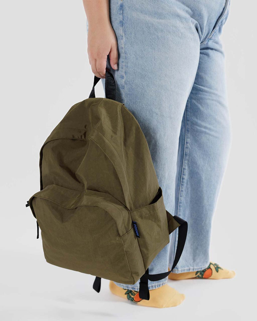 model holding seaweed large nylon backpack
