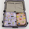 set of 2 large packing cubes: small pink fancy teddy bears, and lilac large fancy cats in a suitcase