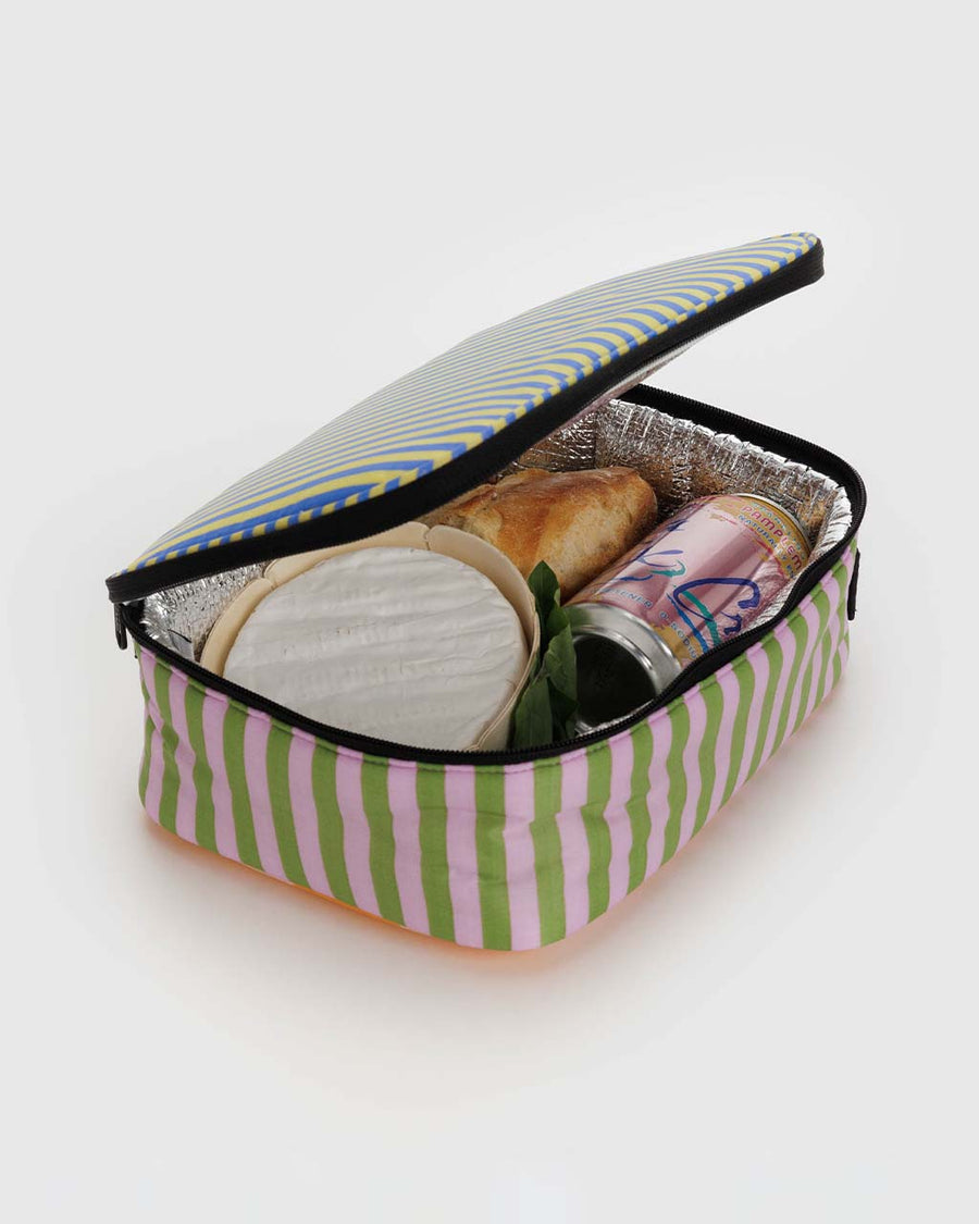 interior of colorful multi stripe lunch box with food inside