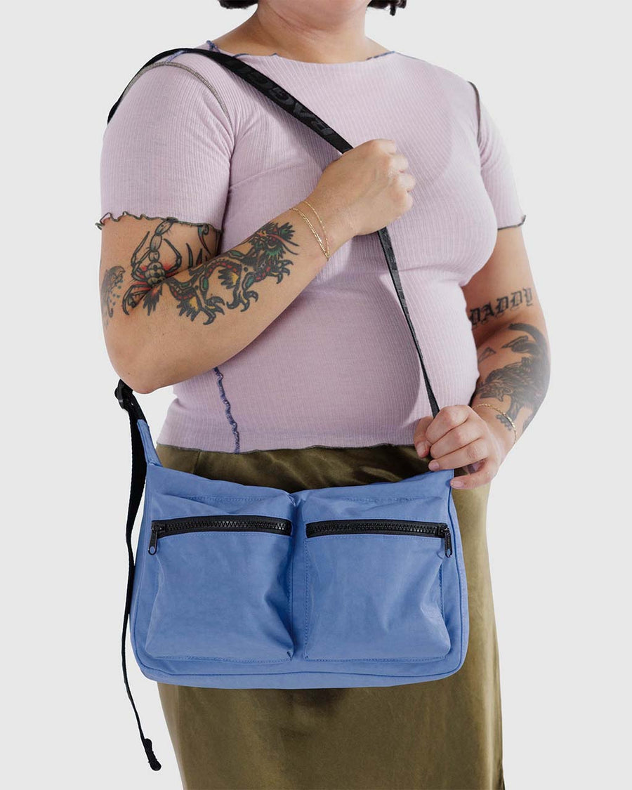 model wearing pansy blue medium cargo bag