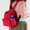 model wearing candy apple medium nylon backpack