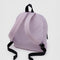 back view of dusty pink medium nylon backpack with black trim