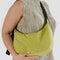 model wearing lime green medium nylon crescent bag