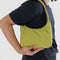 model carrying lime green mini nylon shoulder bag