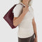 model carrying mahogany recycled leather mini nylon shoulder bag with matching strap and trim