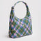 side view of green and pink plaid star nylon shoulder bag