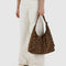 model holding dark brown leopard square nylon shoulder bag