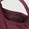 interior zipper of mahogany nylon shoulder bag with matching adjustable strap and zipper