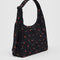 side view of black nylon shoulder bag with matching adjustable strap and zipper and red painted wildflowers print