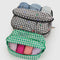 set of 2 packing cubes: green gingham and black and white gingham with colorful hearts with clothing inside