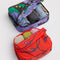 set of two packing cubes: small coral snapdragon and large maroon poppy with clothing inside