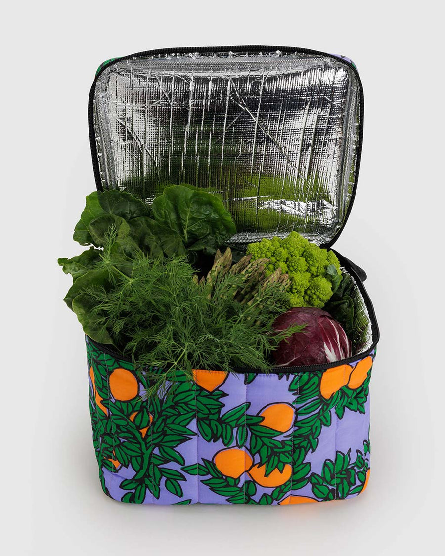 periwinkle puffy cooler with orange tree print with veggies inside