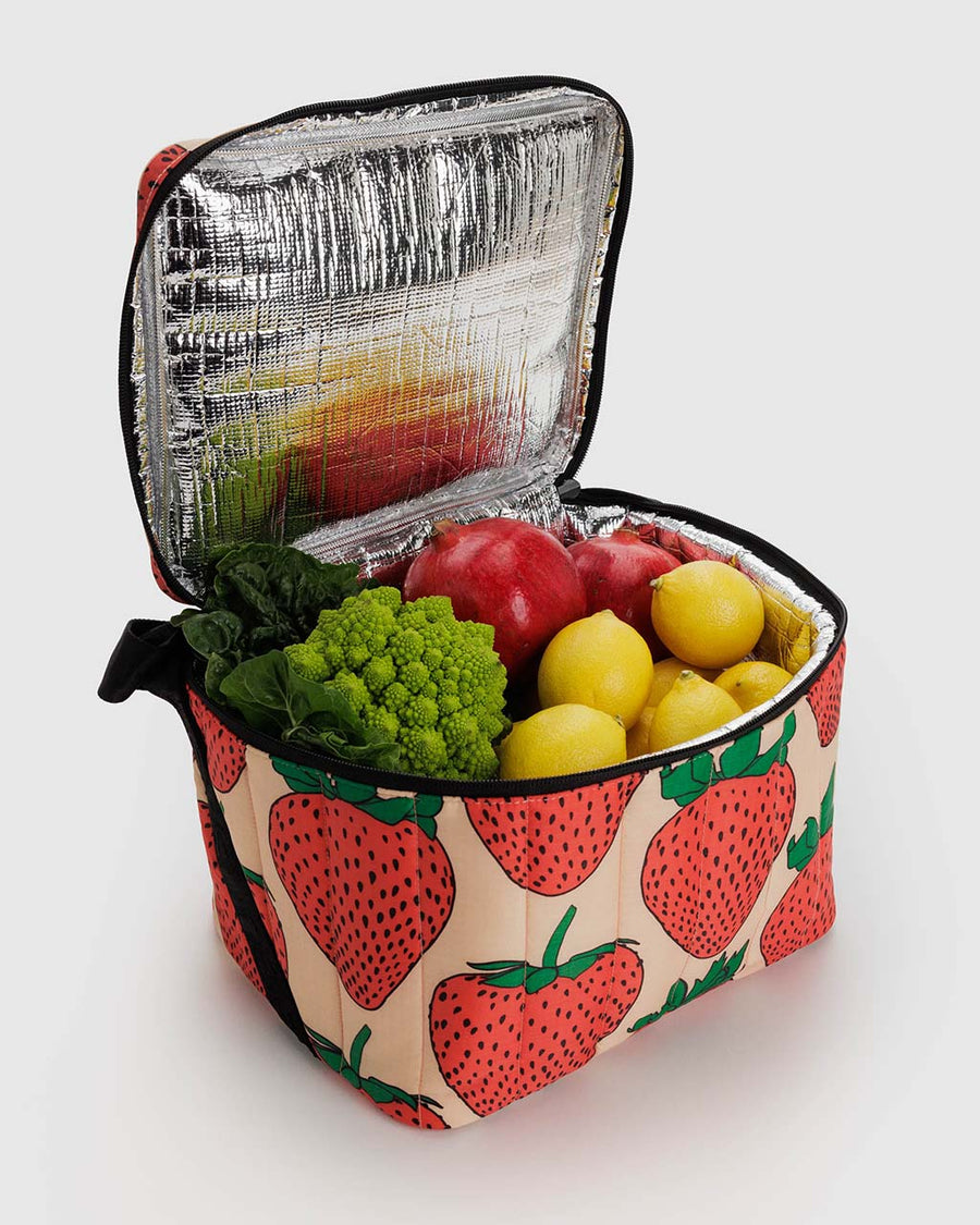 light pink puffy cooler with large strawberry print with fruits and veggies inside