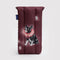 back view of maroon puffy eyeglass sleeve with a fancy dog on it