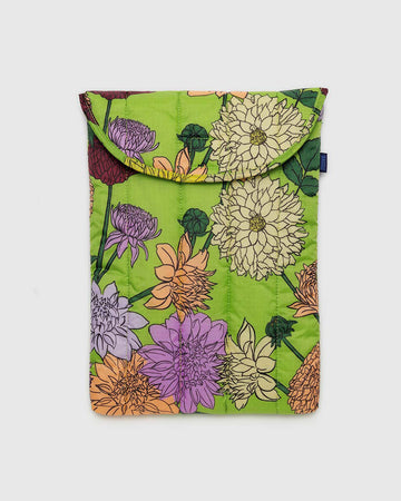green puffy laptop sleeve with colorful dahlia flower print